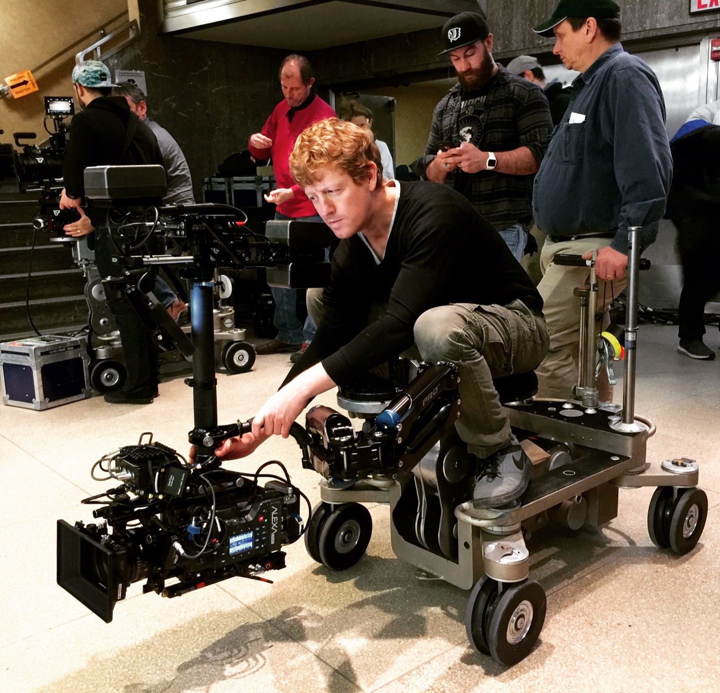 Operating a camera from a dolly in a lobby